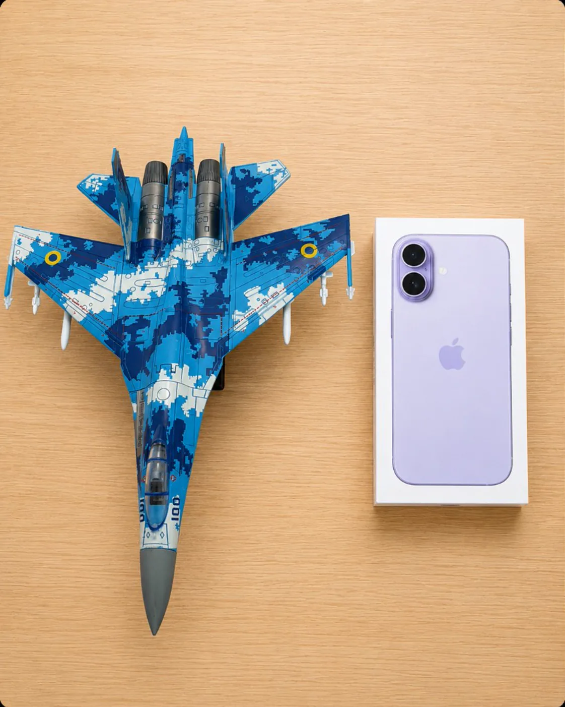 Su-27 Flanker 1:72 scale model next to an iPhone box for size reference